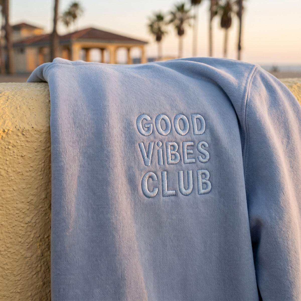 Close-up of the Good Vibes Club embroidery on the Faded Powder Club Hoodie.